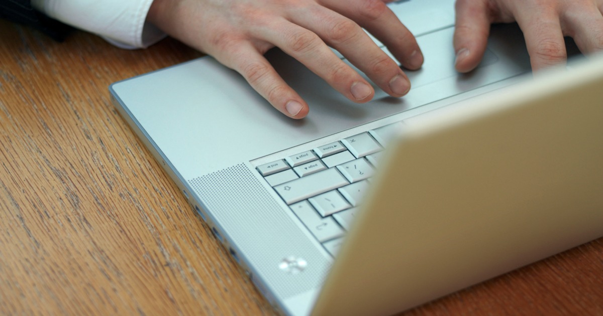 image of person typing on laptop protecting their privacy