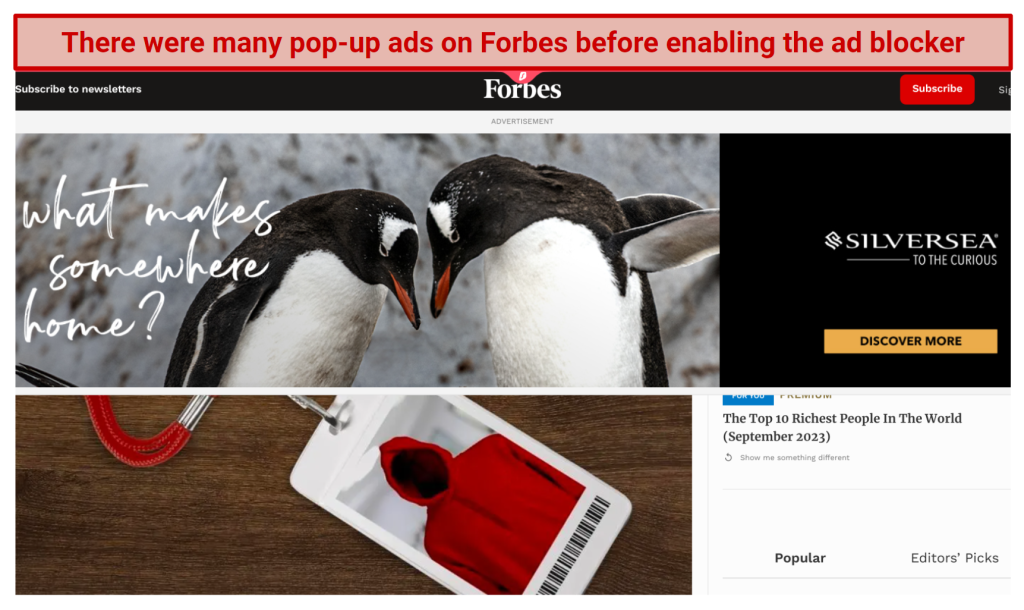 A screenshot showing the Forbes website full of banner ads before enabling Surfshark's ad blocker on its Chrome extension