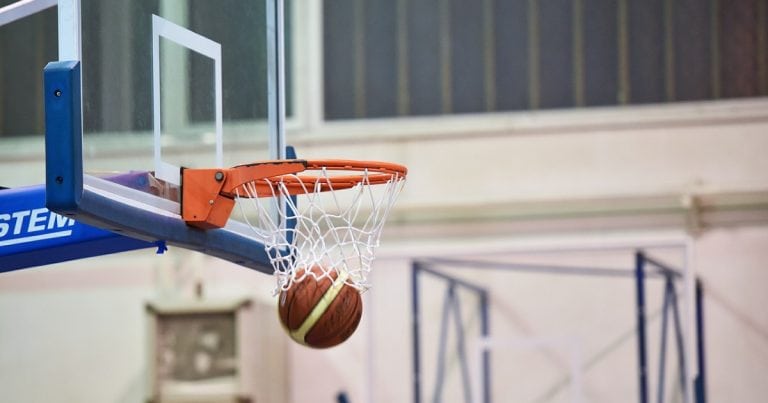 Basketball going through a hoop,