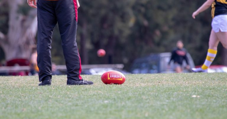 Australian Rules Football ball on field