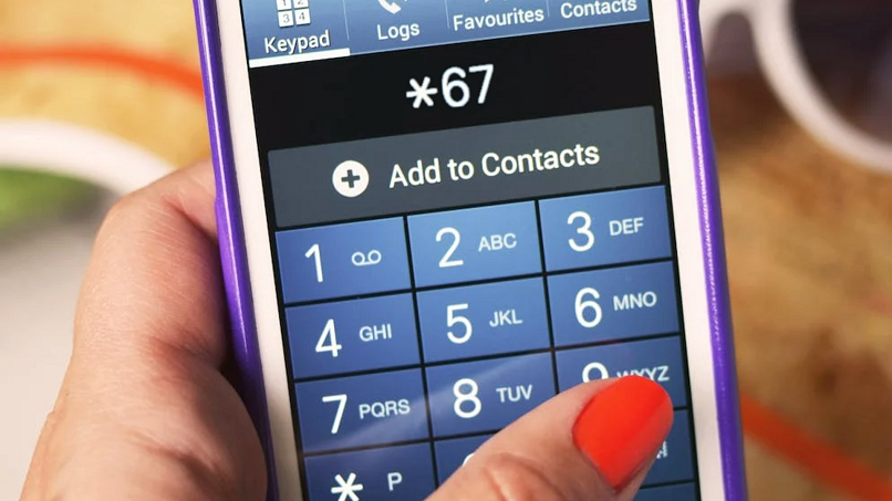 Image of a smartphone dialer app, with a person typing *67